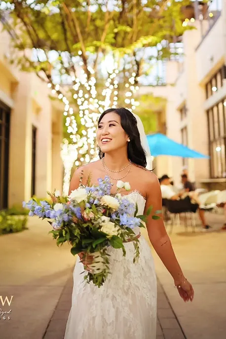 Bride and groom sharing a candid, naturally lit moment outdoors